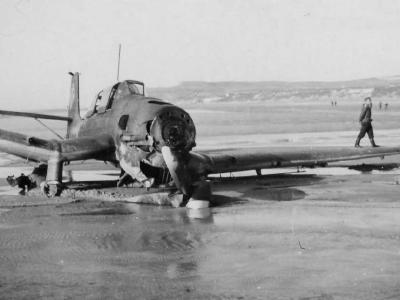 destroyed Ju 87 Stuka on beach