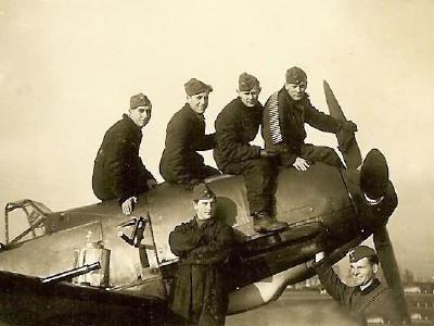 Messerschmitt bf109 and luftwaffe ground crewmen with ammo belts