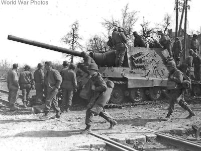 Jagdtiger 234 of the 653 sPzJgAbt and troops from U.S. 36 ID in Soultz France 18 March 1945