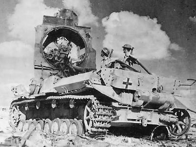 British Soldiers Look Over destroyed German Afrika Korps Panzer IV Tank