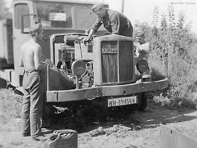 German mechanics working on engine of Krupp truck