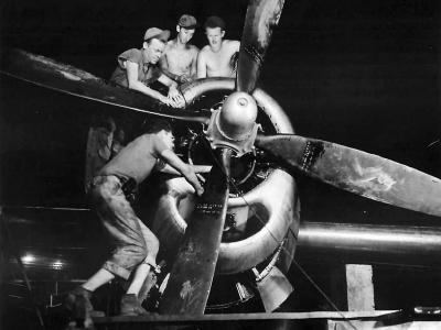 21st BC crew working on engine of B-29 Superfortress. 1945