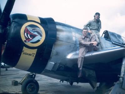 Capt Moore and Lt Kreimann of 15th Fighter Group on P-47D Thunderbolt Stinger V nose art, color photo