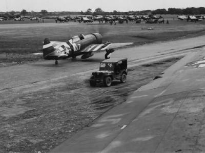 P-47 Thunderbolts of the 406th Fighter Group line up for take off before a mission