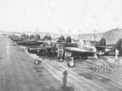 Line of P-61 Night Fighter Planes Parked on Airfield
