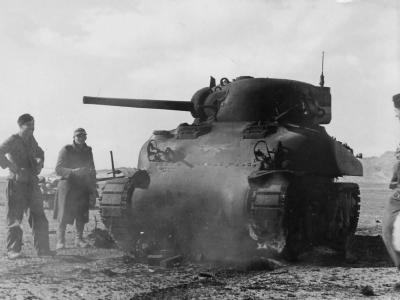 Destroyed M4A1 Sherman tank and Afrika Korps troops Tunisia