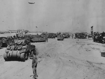 British Sherman tanks and DUKWs on Normandy Beach 7 June 1944