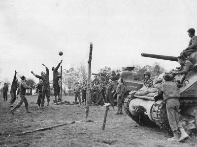 US Army soldiers Playing Volleyball by M4 Sherman Tanks in Germany 1944