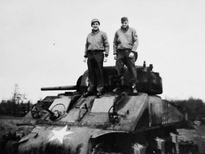 Wrecked M4A2 Sherman Tank and GIs April 1945