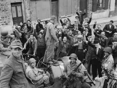 Civilians Cheer US Forces Entering Barneville France June 1944
