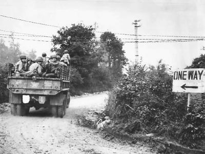GMC truck loaded with US troops of the 4th Infantry Division move up to the front on July 23rd for Operation Cobra assault between the judge and Chapelle in Hébécrevon