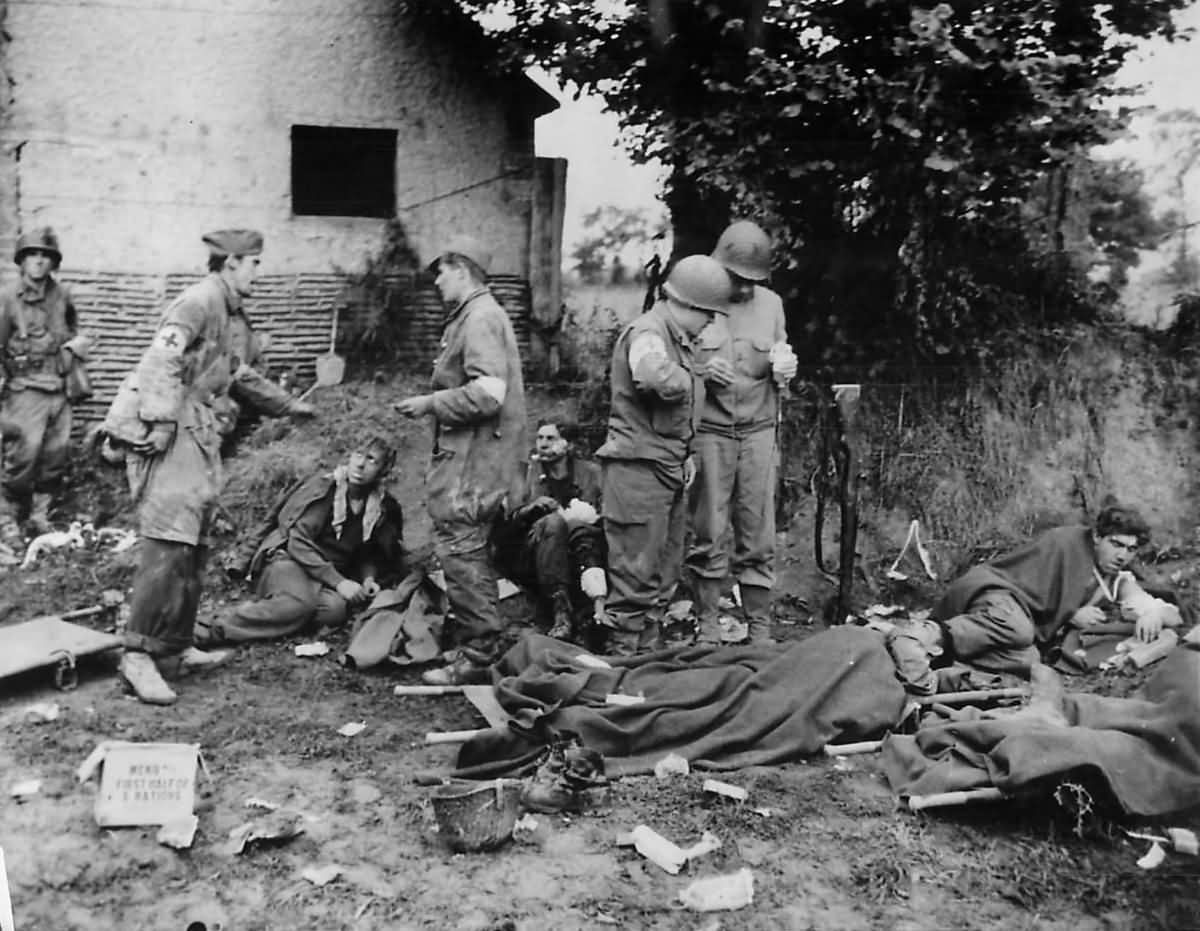 German and US Medics Tend Wounded German POWs in St. Lo Normandy 1944