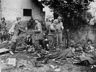 German and US Medics Tend Wounded German POWs in St. Lo Normandy 1944