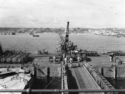 Mulberry harbour A off D-Day Omaha Beach in background at Saint-Laurent-sur-Mer