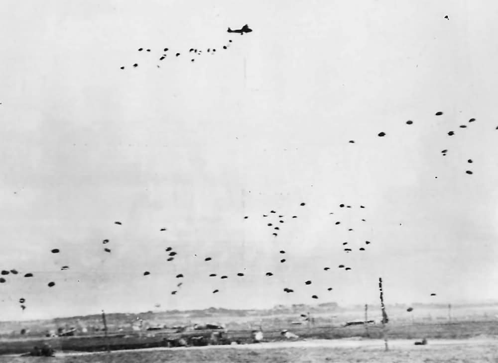 RAF aircraft drop supplies by parachute to British Airborne Division in Normandy 1944