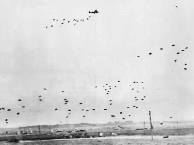 RAF aircraft drop supplies by parachute to British Airborne Division in Normandy 1944