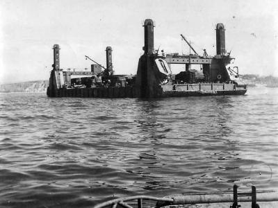 Spud Pier Section of Mulberry B Harbor Arrives at Arromanches Normandy