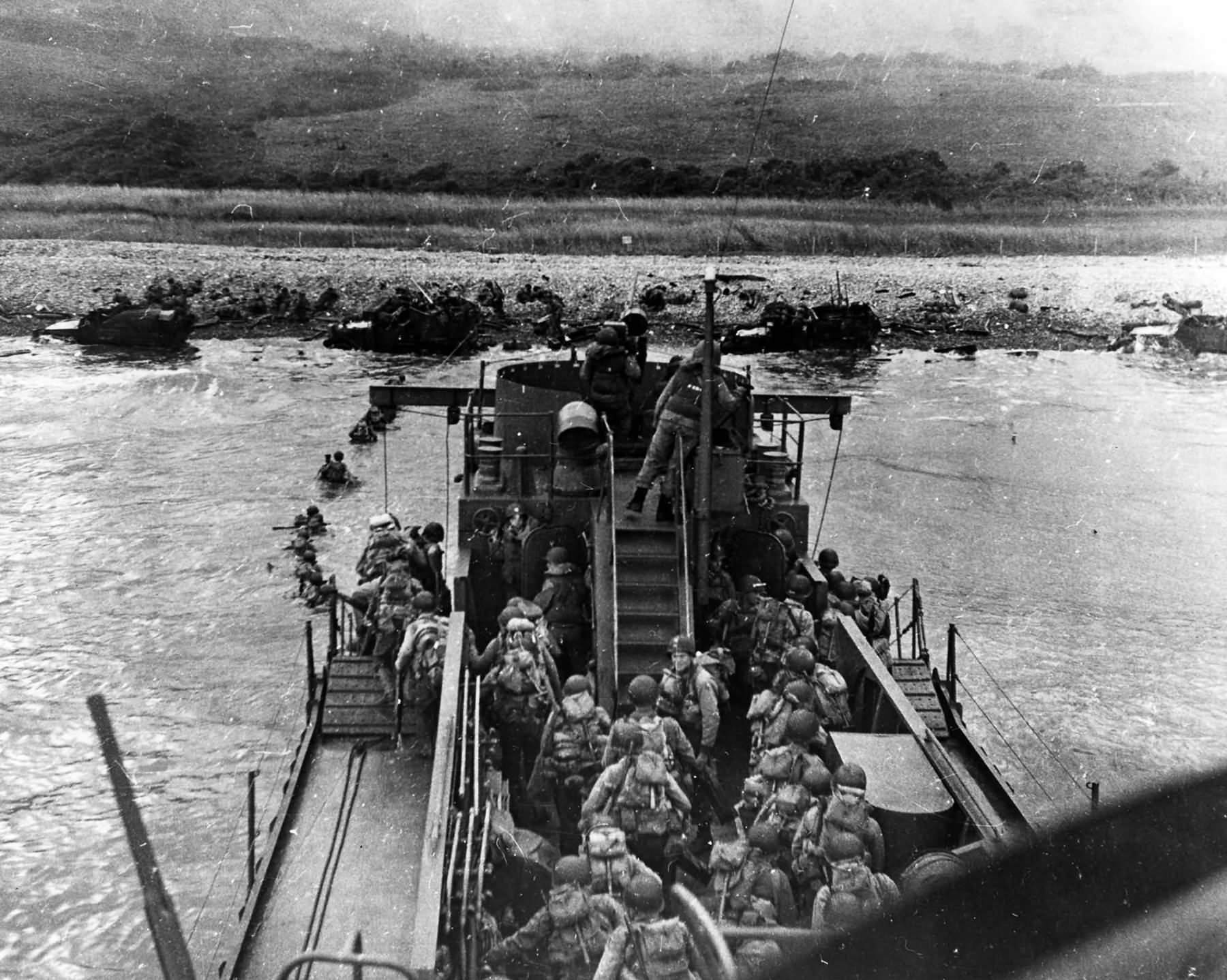 US Troops land from USS LCI(L)-412 during the D-Day assault on Omaha Beach, 6 June 1944