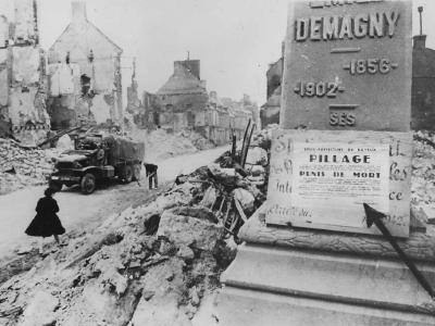US Army CCKW truck in bombed ruins of Isigny