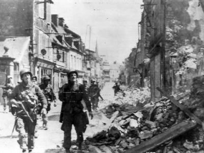 US Army Troops take bombed Carentan