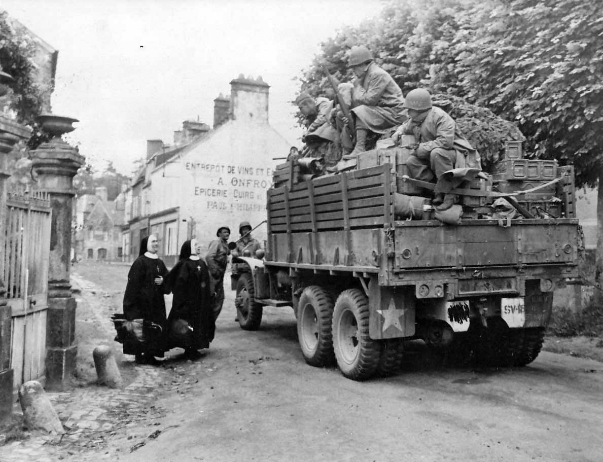 US Infantry in truck liberated Bricquebec Normandy 1944