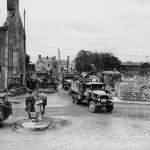1055th Engineers Clear Rubble in Isigny France with Gas Shovel Trucks Dozer