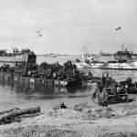 111th Naval Construction Battalion Landing at Omaha Beach D-Day Normandy 1944. LCT-562 and USS LST-502 in the background