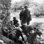 GI shot by German sniper near Cherbourg, 25 June 1944