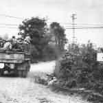 GMC truck loaded with US troops of the 4th Infantry Division move up to the front on July 23rd for Operation Cobra assault between the judge and Chapelle in Hébécrevon