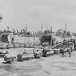 LSTs loading tracked vehicles carts for D-Day assault in England