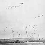 RAF aircraft drop supplies by parachute to British Airborne Division in Normandy 1944