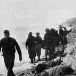 US Army 16th Infantry Regiment, 1st Division with Wounded on Omaha Beach Normandy 1944