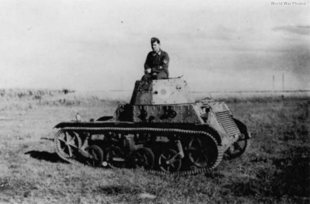 German soldier poses atop an AMR 33