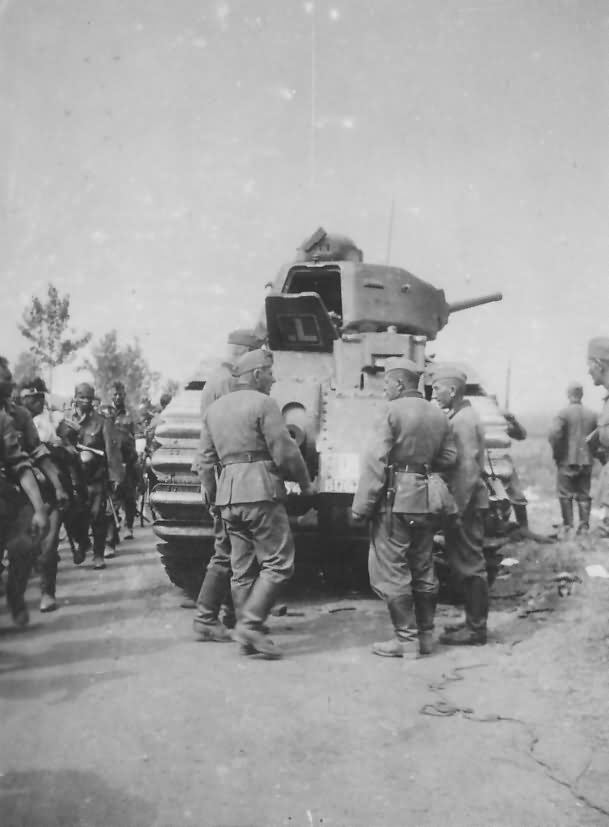 German soldiers examines a abandoned French B1 bis Tank during the attack on France in May/June 1940