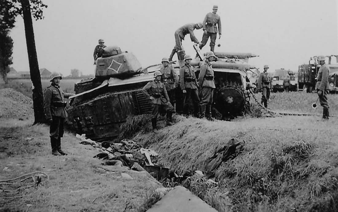 German soldiers examining knocked out Char B1 bis tank 1940