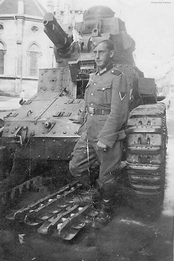 German soldier posing in front of D1 tank