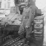 German soldier posing in front of D1 tank