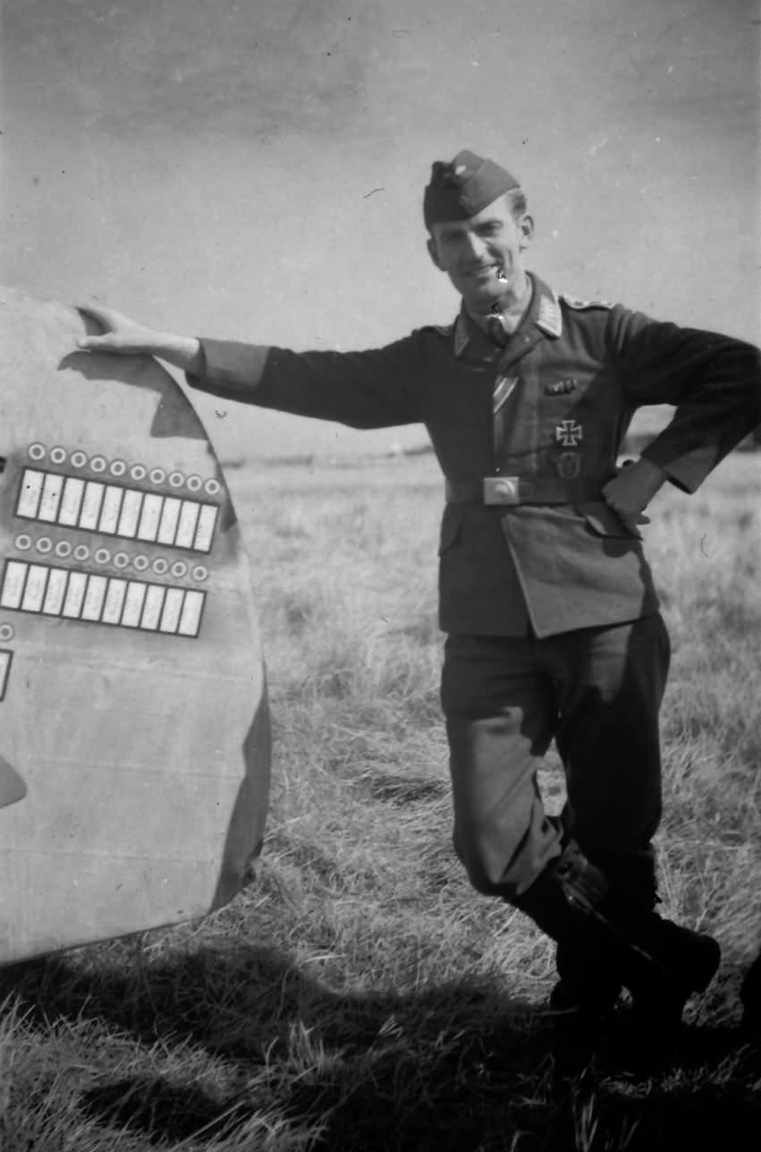 pilot Werner Machold by the tail of his Bf 109 JG2