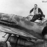 Pilot climbs out of cockpit of Bf109E