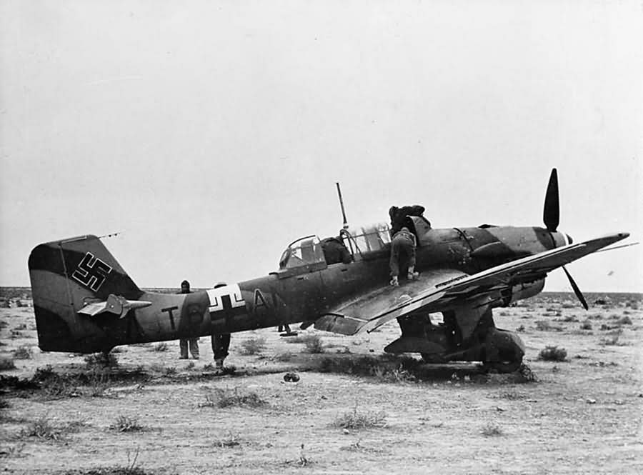 British troops inspect a Junkers Ju 87R-2 Stuka, code T6+AN, which made an emergency landing in the desert December 1941