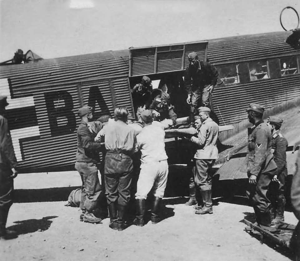 Wounded are off-loaded from a Junkers Ju 52 MEDEVAC