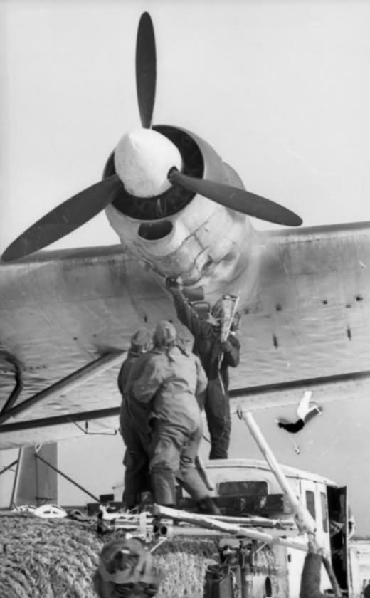 Luftwaffe ground crew work on engine of a Me 323