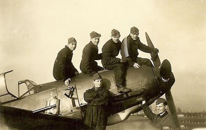 Messerschmitt bf109 and luftwaffe ground crewmen with ammo belts