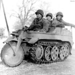 102nd Infantry Division GI’s in captured Kettenrad Baesweiler 24 January 1945