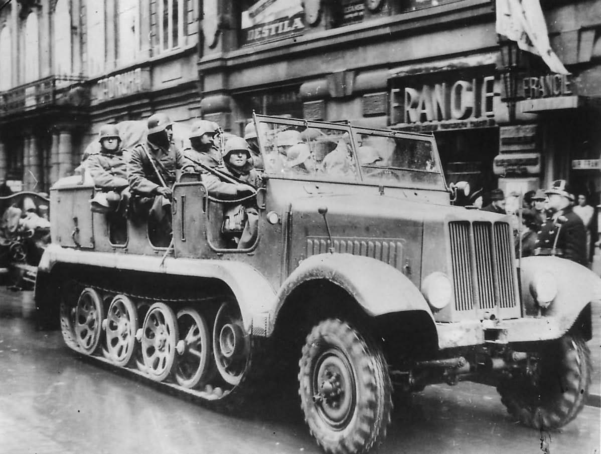German Troops in SdKfz 6 Towing 10,5 cm leFH 18 in Prague 1939