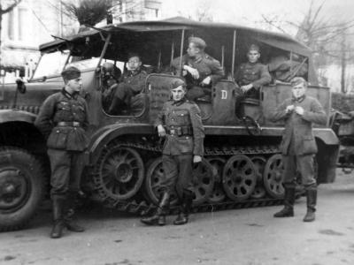 Wehrmacht soldiers next to a SdKfz 6/1