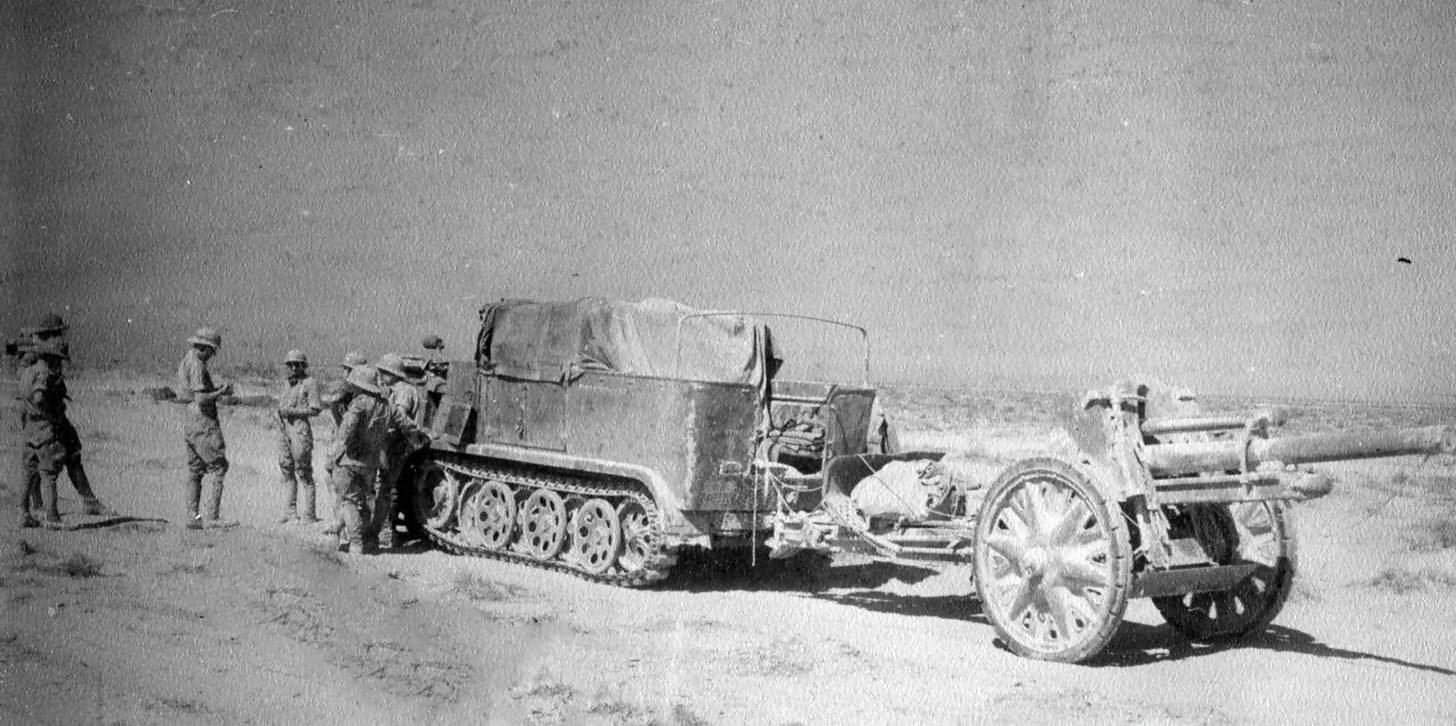 Sd. Kfz. 11 of the Afrika Korps towing a 10,5 cm leFH 18