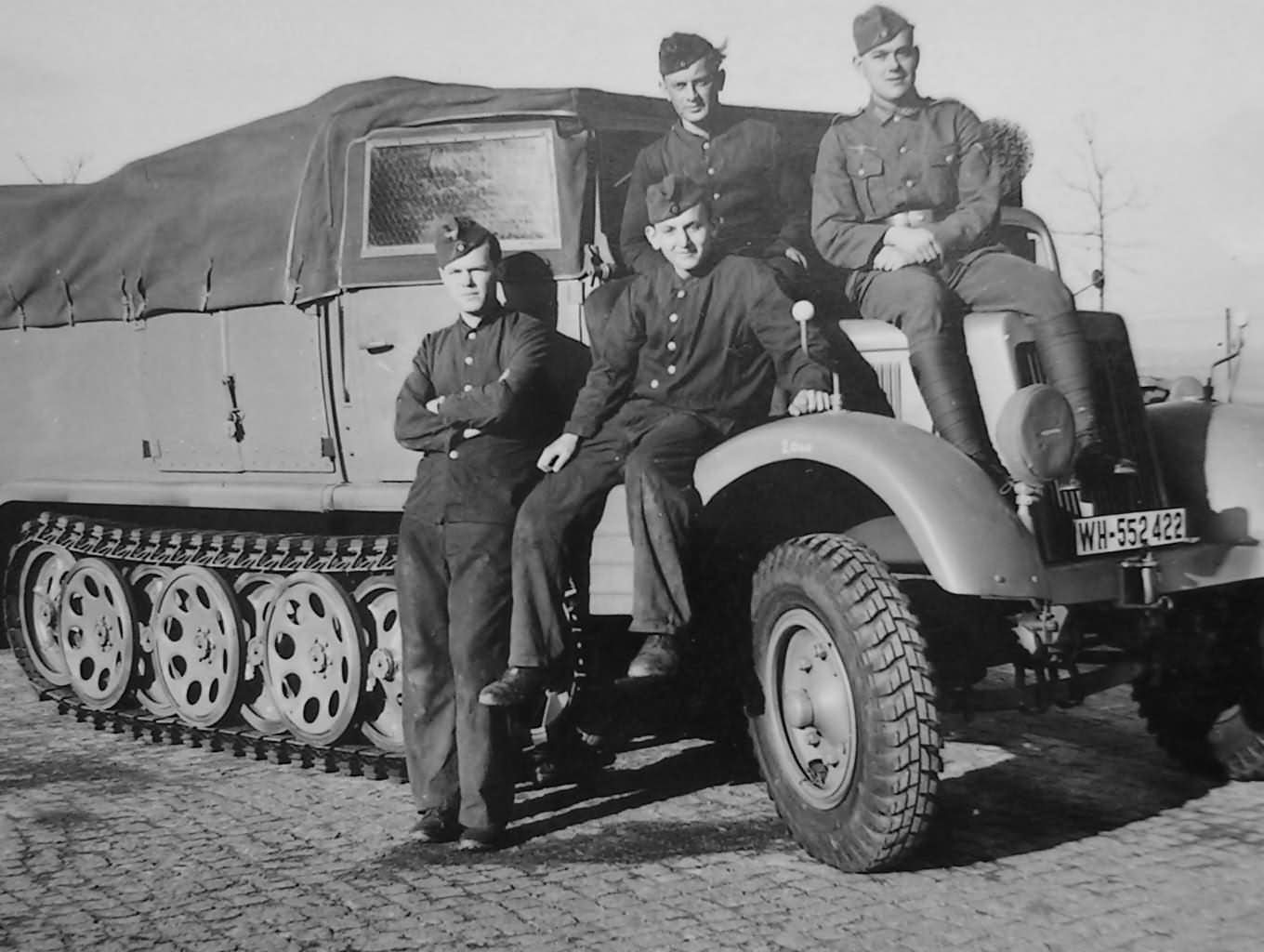 wehrmacht soldiers next to a SdKfz 11 halftrack WH-552422