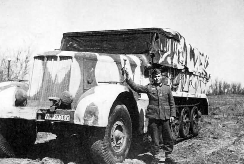 German soldier posing beside a SdKfz 9