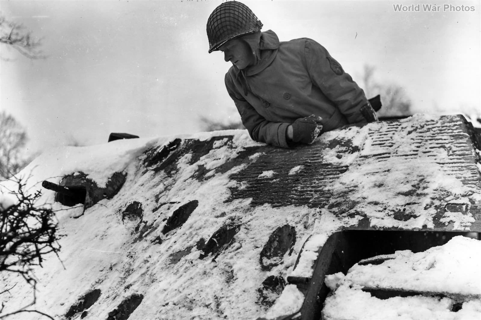 6th Armored GI Examines Hits on Tiger